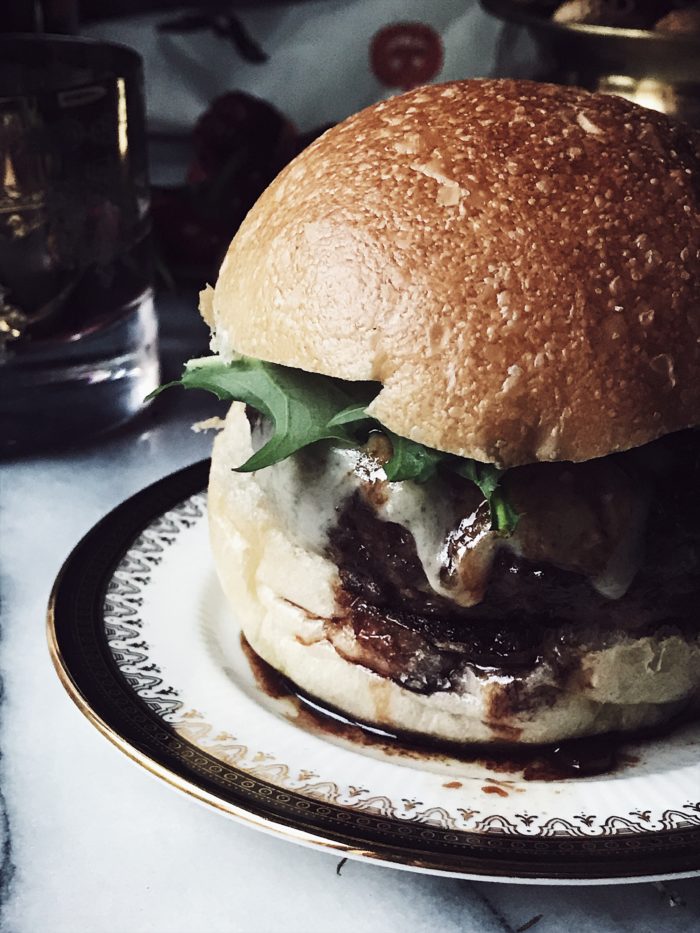 A ground beef cheesy Italian burger recipe with parmesan cheese and red wine sauce. Get this and more delicious Italian recipes on GP. #italianrecipes