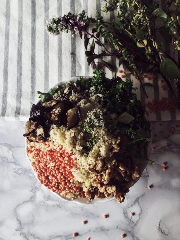 moroccan style red lentils & cous cous buddha bowl with eggplant, walnuts and sunflower seeds