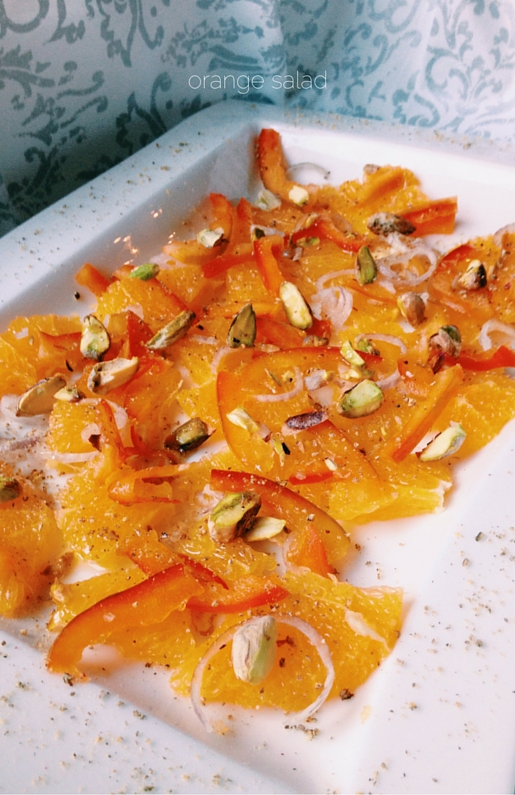 orange and onion salad in a white tray