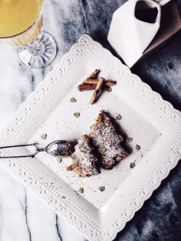 pandoro french toast shaped as a Christmas tree and served on a white plate