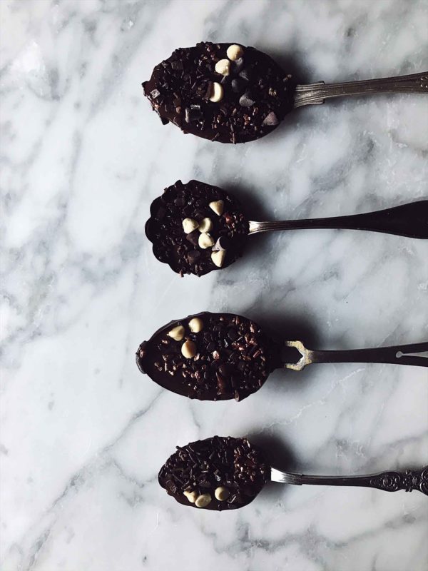 Chocolate covered spoons Chocolate covered spoons on a marble surface