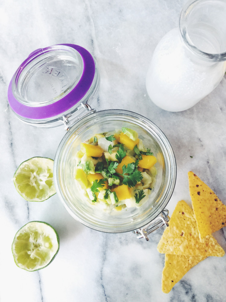 the mango ceviche recipe: white fish marinated in lime juice and coconut milk, seasoned with mango and avocado