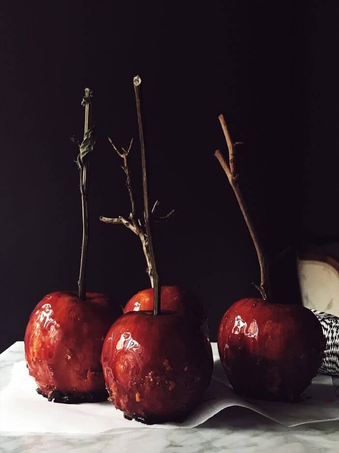 red Caramel apples on a stick