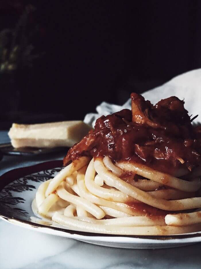 tomato chicken pasta on a vintage plate