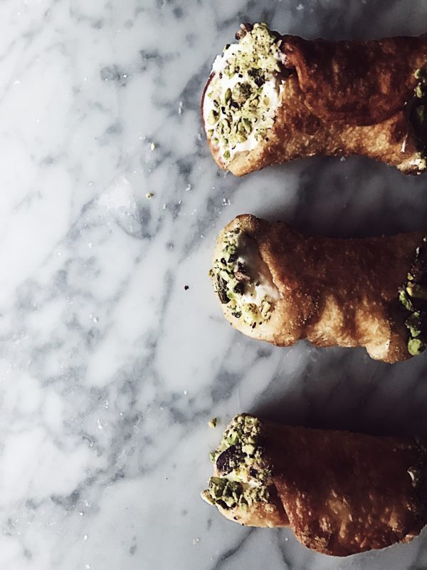 Fried pizza dough recipe: cannoli shaped fried pizza stuffed with stracchino, pesto & pistachio grain.