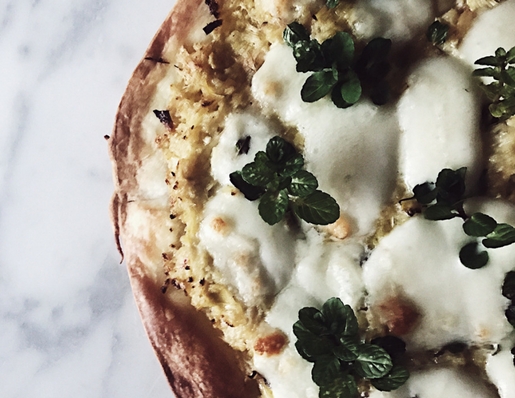 artichokes pizza recipe in a cast iron skillet