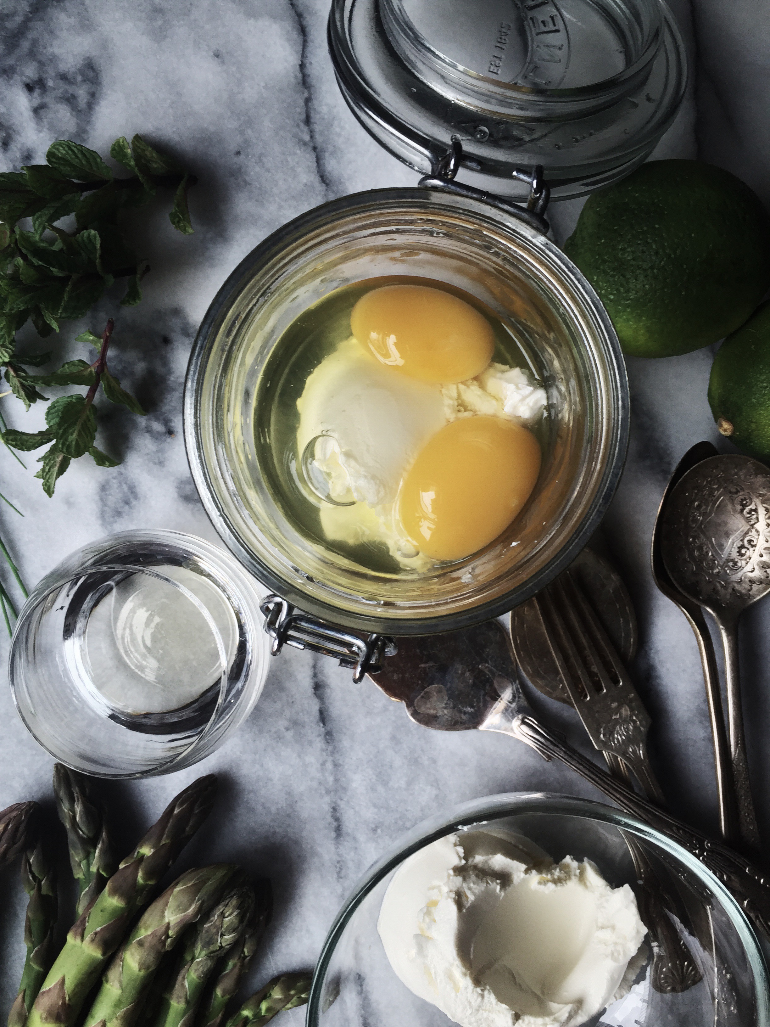 Eggs en cocotte, cooked in a jar, with asparagus and heavy cream
