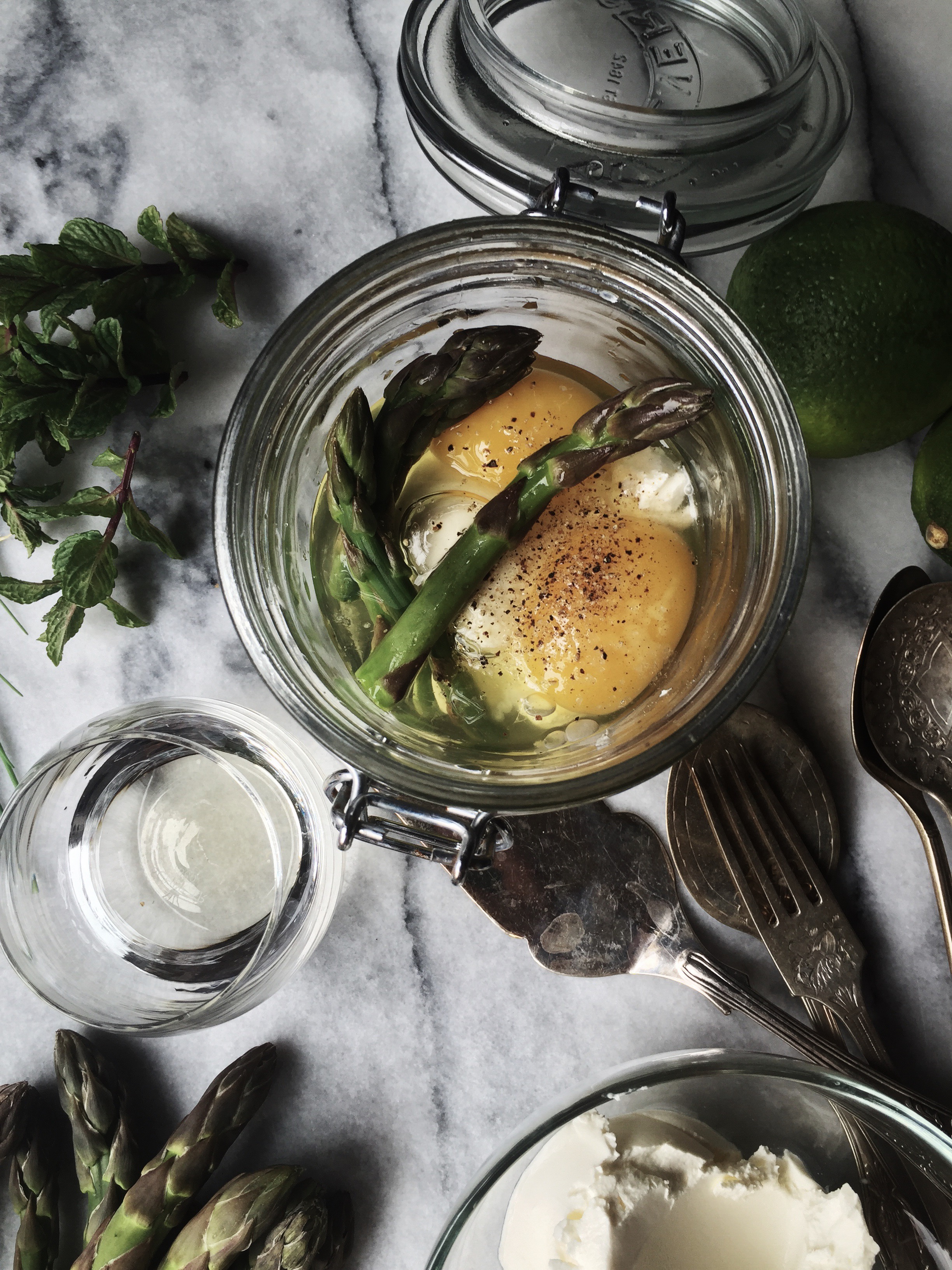 Eggs en cocotte, cooked in a jar, with asparagus and heavy cream