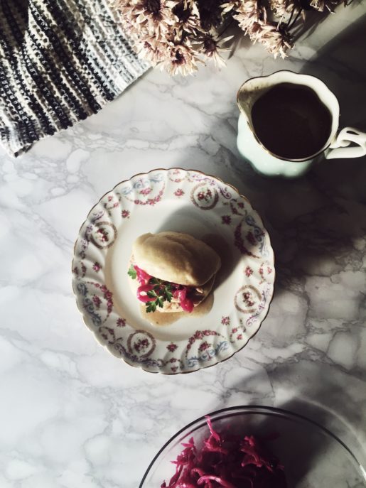 chinese steamed bao buns with cashew milk marinated chicken and sauerkrauts