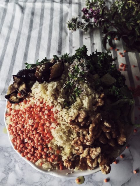 moroccan style red lentils & cous cous buddha bowl with eggplant, walnuts and sunflower seeds