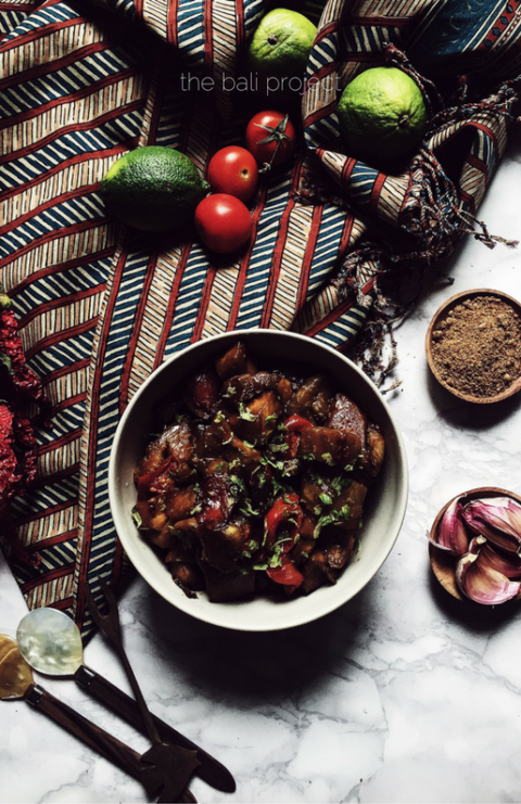 balinese wok fried eggplants seasoned with soy sauce, tomato and lime zest