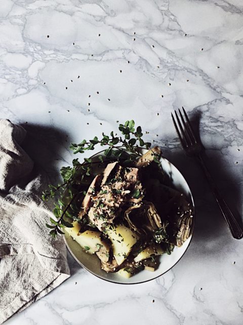 an Italian tuna salad recipe with steamed artichokes and potatoes, fresh oregano and mint, and sesame seeds