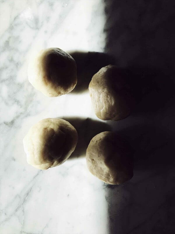 four piadina dough balls
