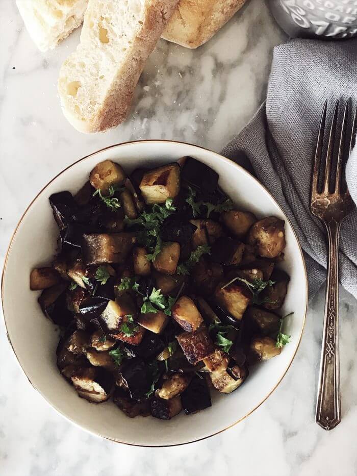 eggplants al funghetto in a white bowl