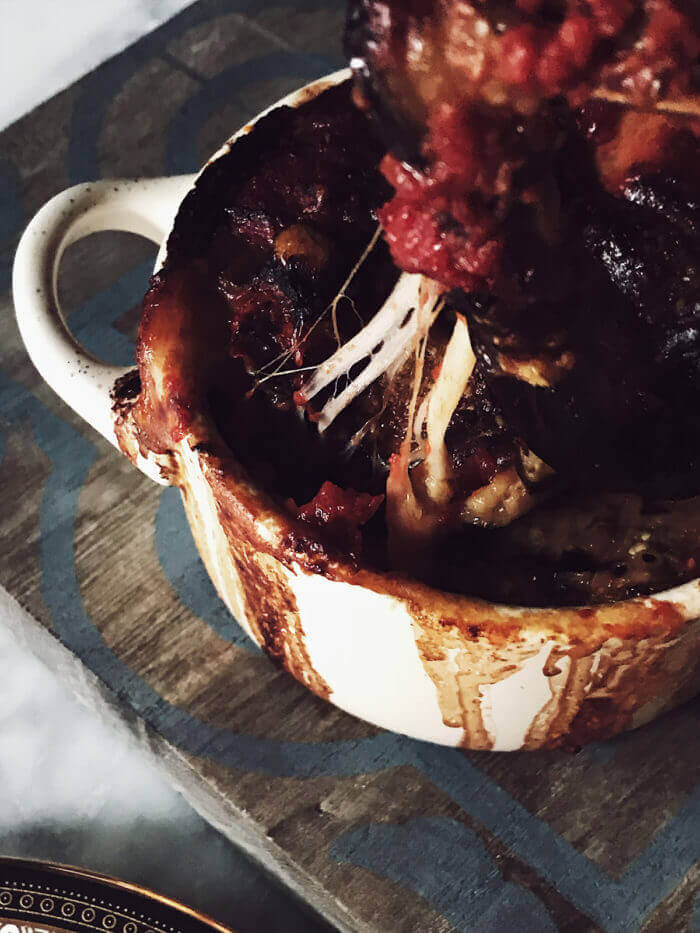 authentic Italian eggplant parmigiana in a white casserole