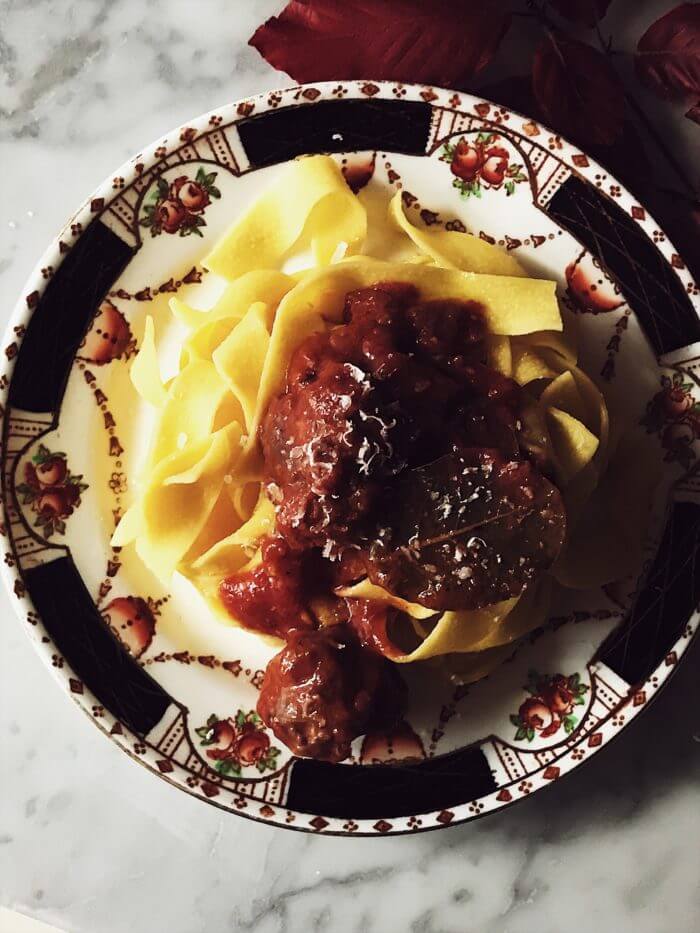 Italian sausage sauce poured over tagliatelle pasta