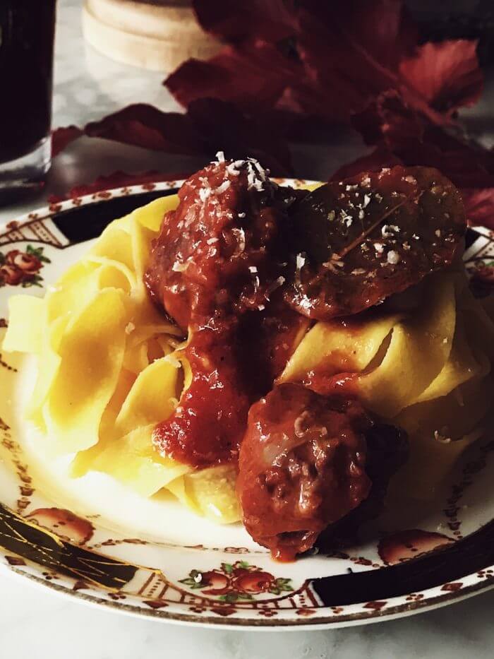 Italian sausage sauce poured over tagliatelle pasta and sprinkled with parmesan cheese