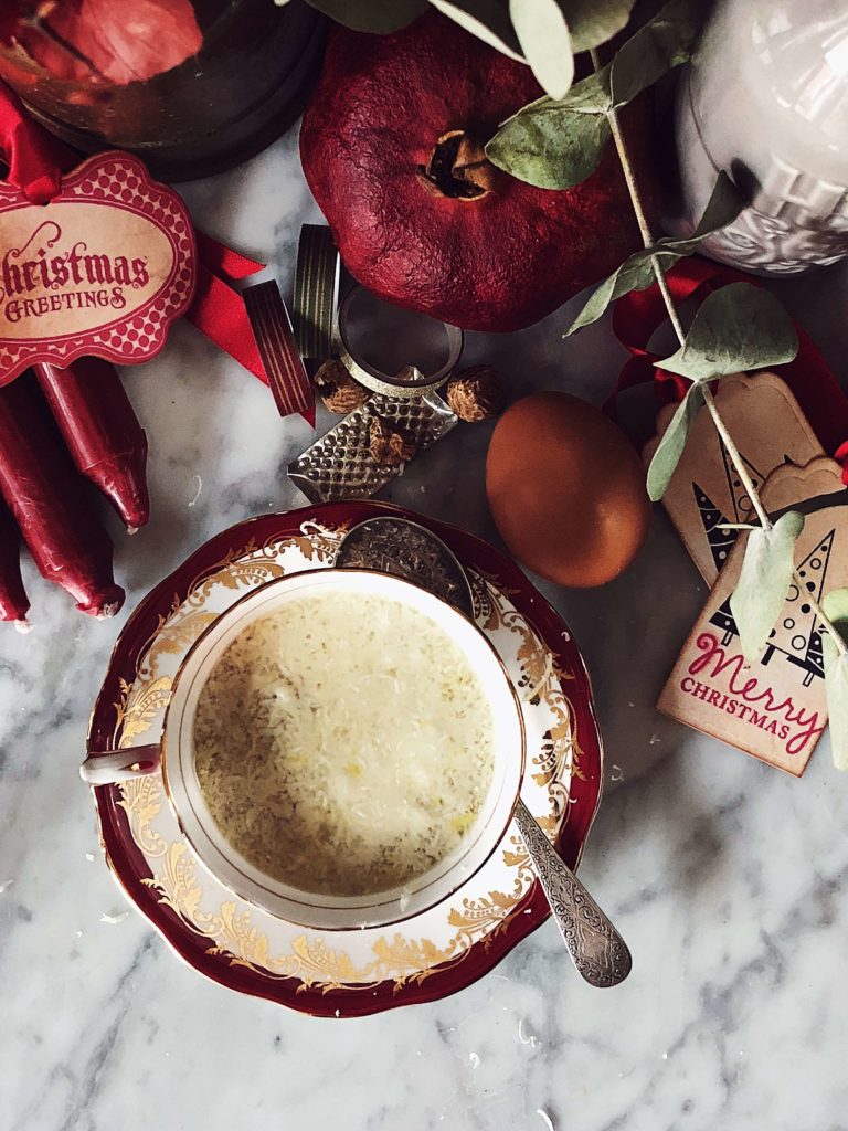 stracciatella soup served in a vintage red and gold china cup