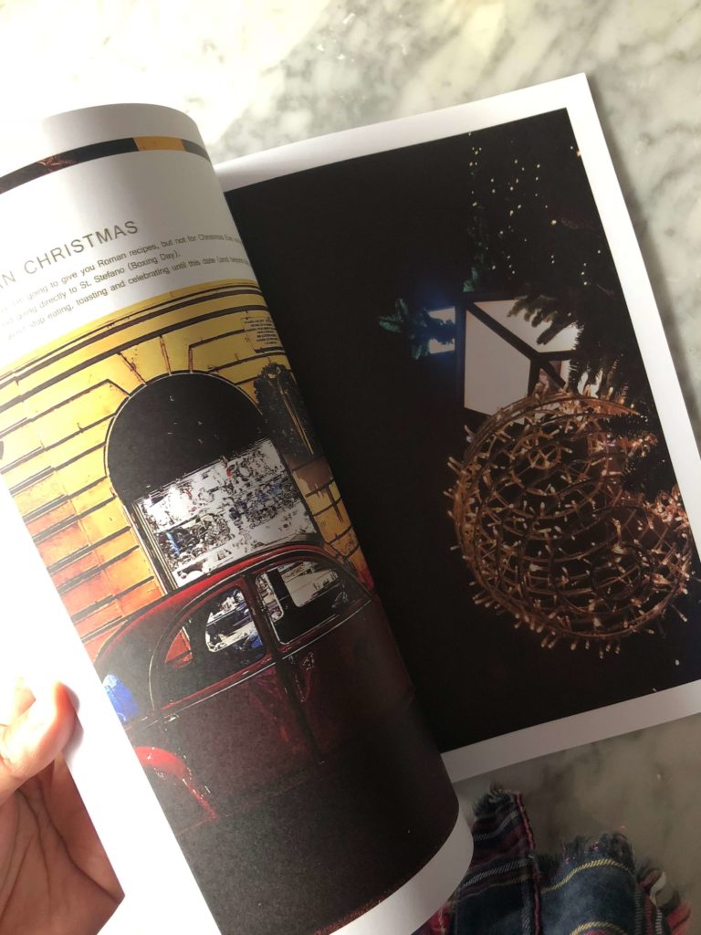 a red car and Christmas street lights in a page of the Gourmet Mag