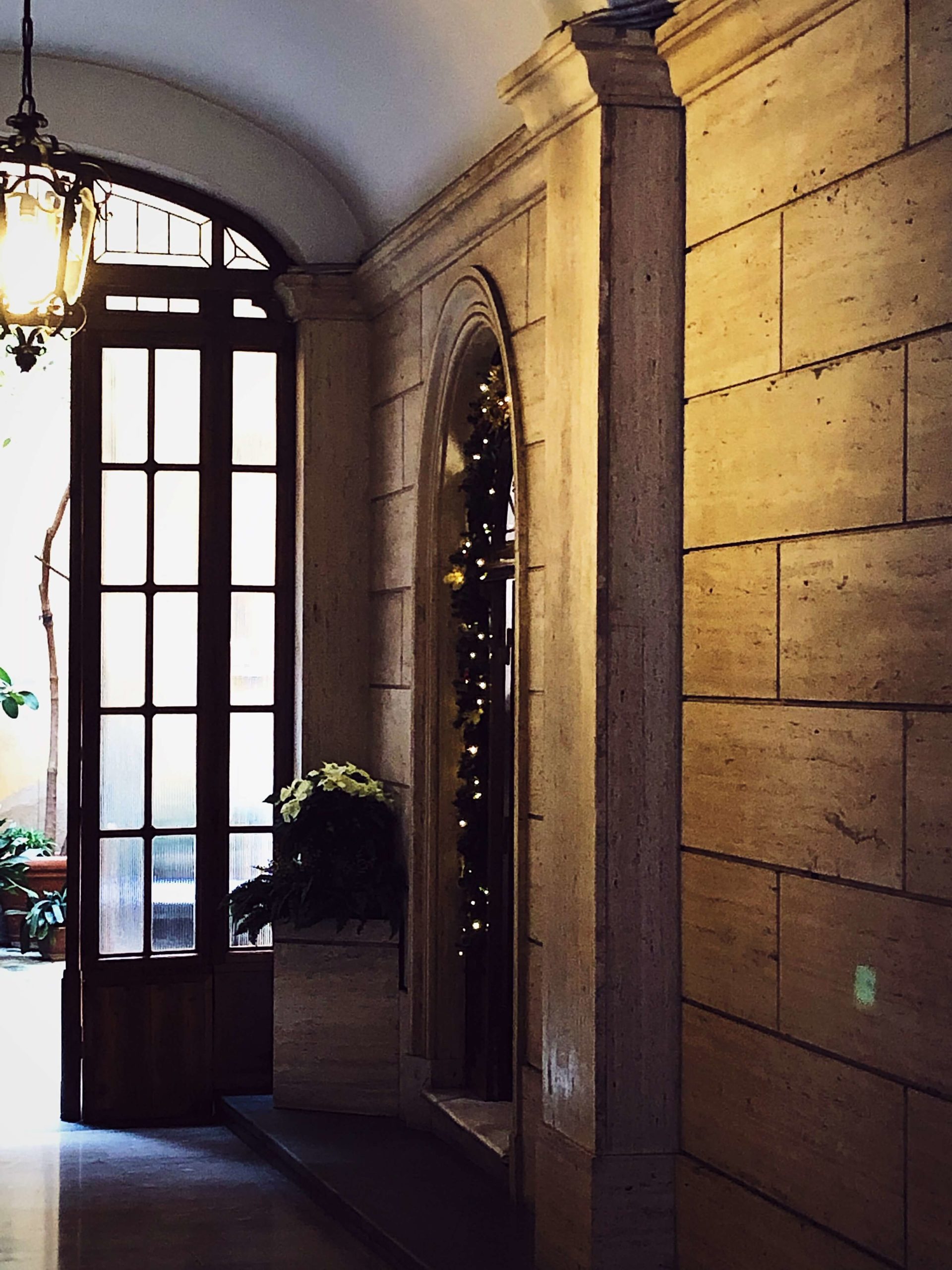Christmas Eve in Italy Roman palazzo entrance decorated for Christmas