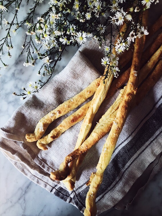 breadsticks recipe grissini laying on a kitchen cloth