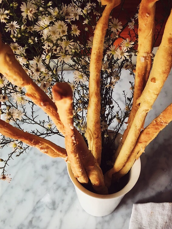 breadsticks recipe grissini in a white vase with flours