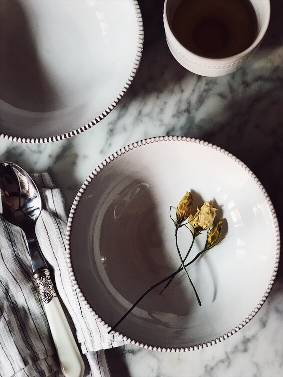 minestrone soup recipe-empty bowl with dried flowers