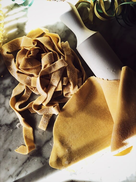 tagliatelle pasta homemade in Italy #gourmetproject #italianrecipes #pasta tagliatelle pasta dough and rolling pin