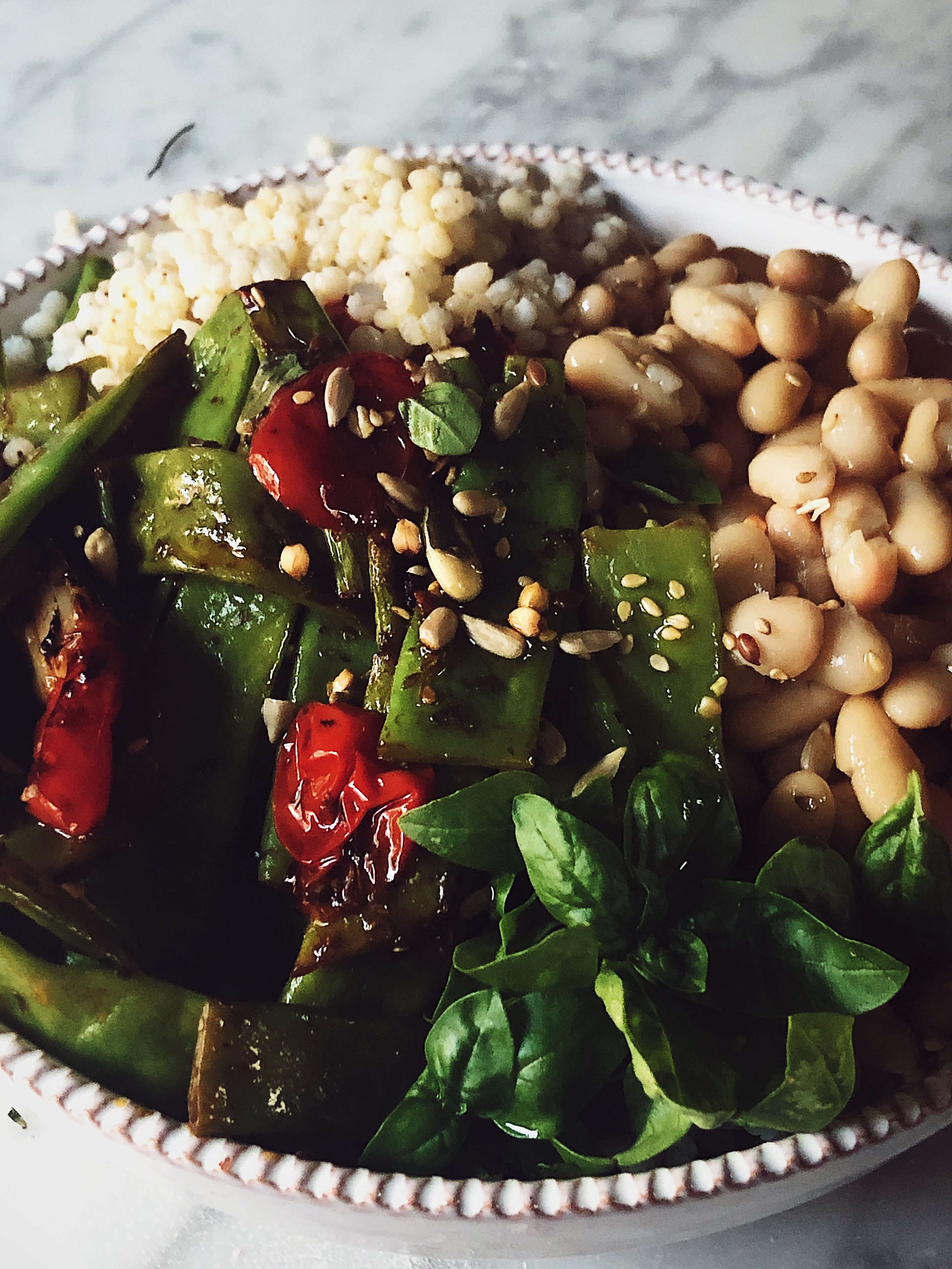 buddha bowl with farro buddha bowl in a white porcelain bowl