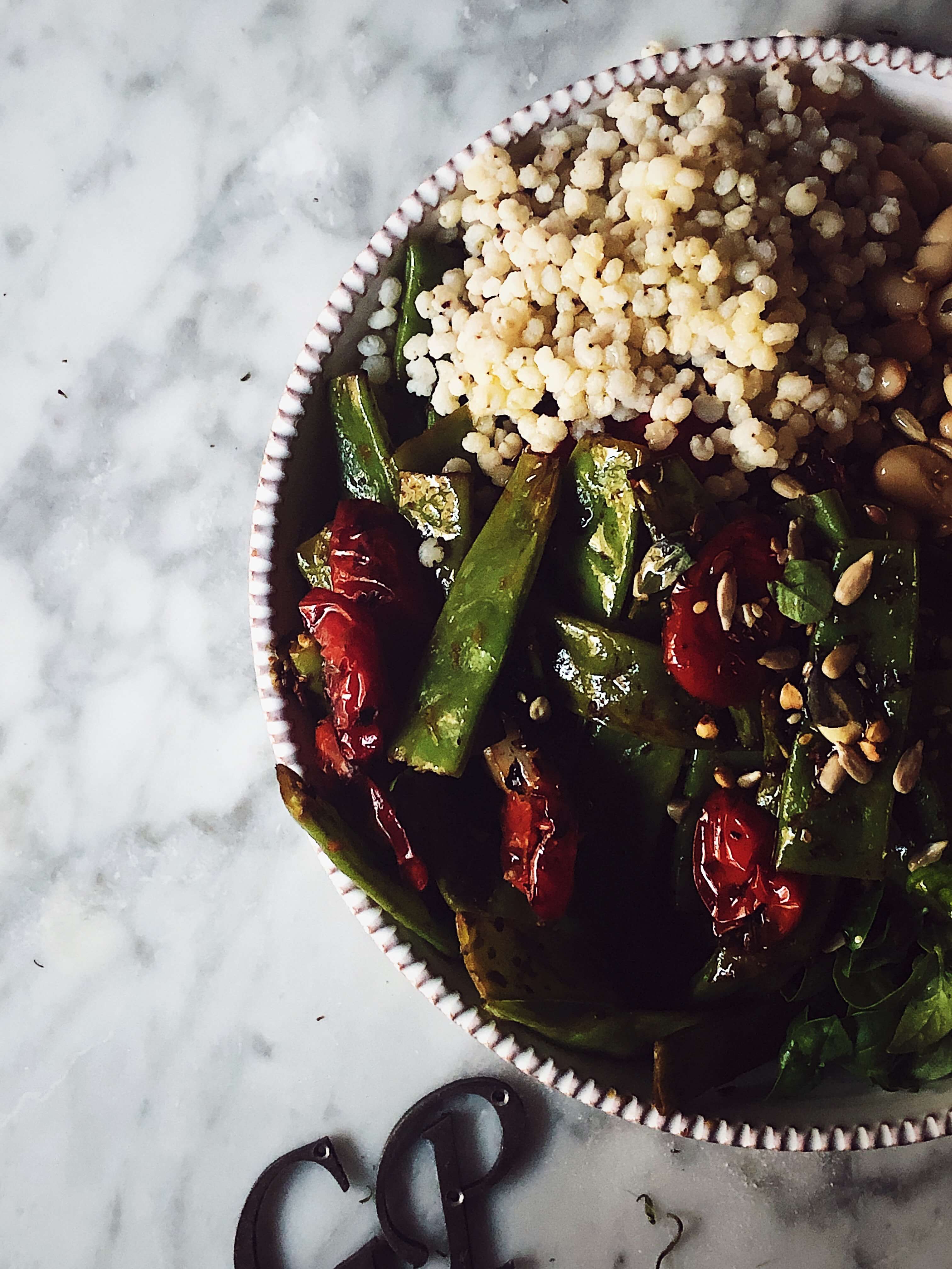 buddha bowl with farro sugar snaps tomatoes and beans