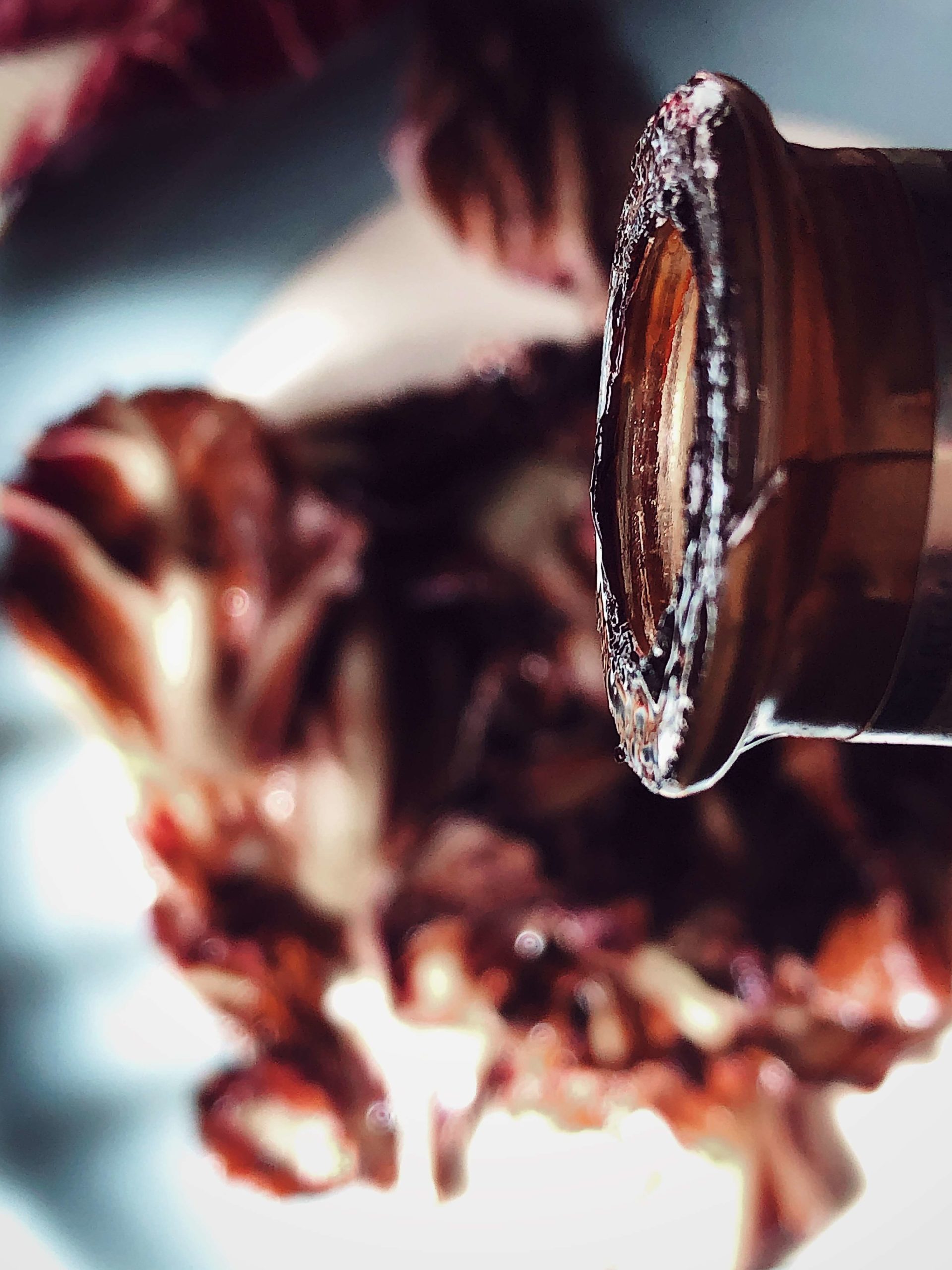 bottle of balsamic vinegar pouring over grilled radicchio