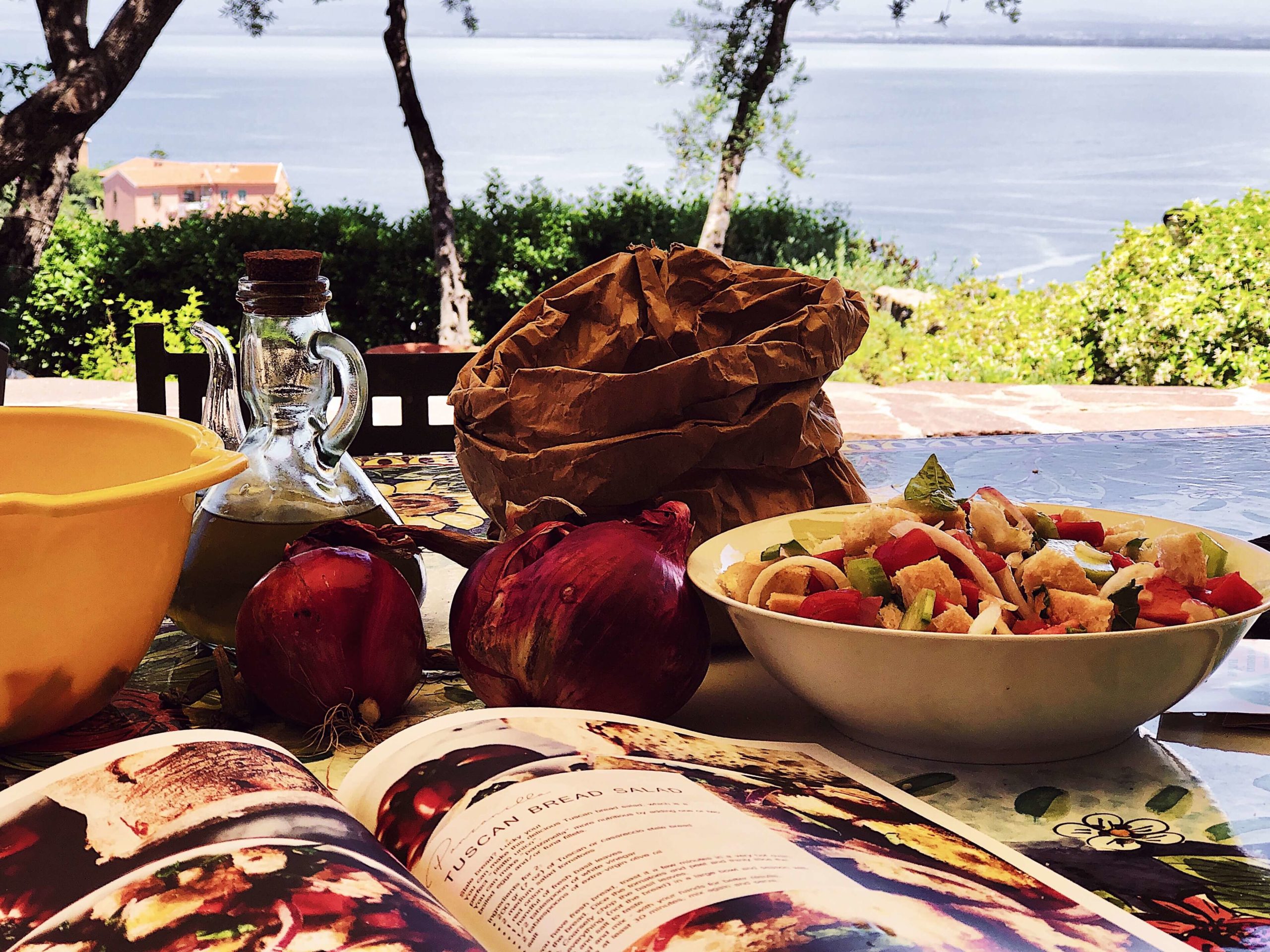 Tuscan-panzanella-salad panzanella salad served for lunch with a summer Tuscan view