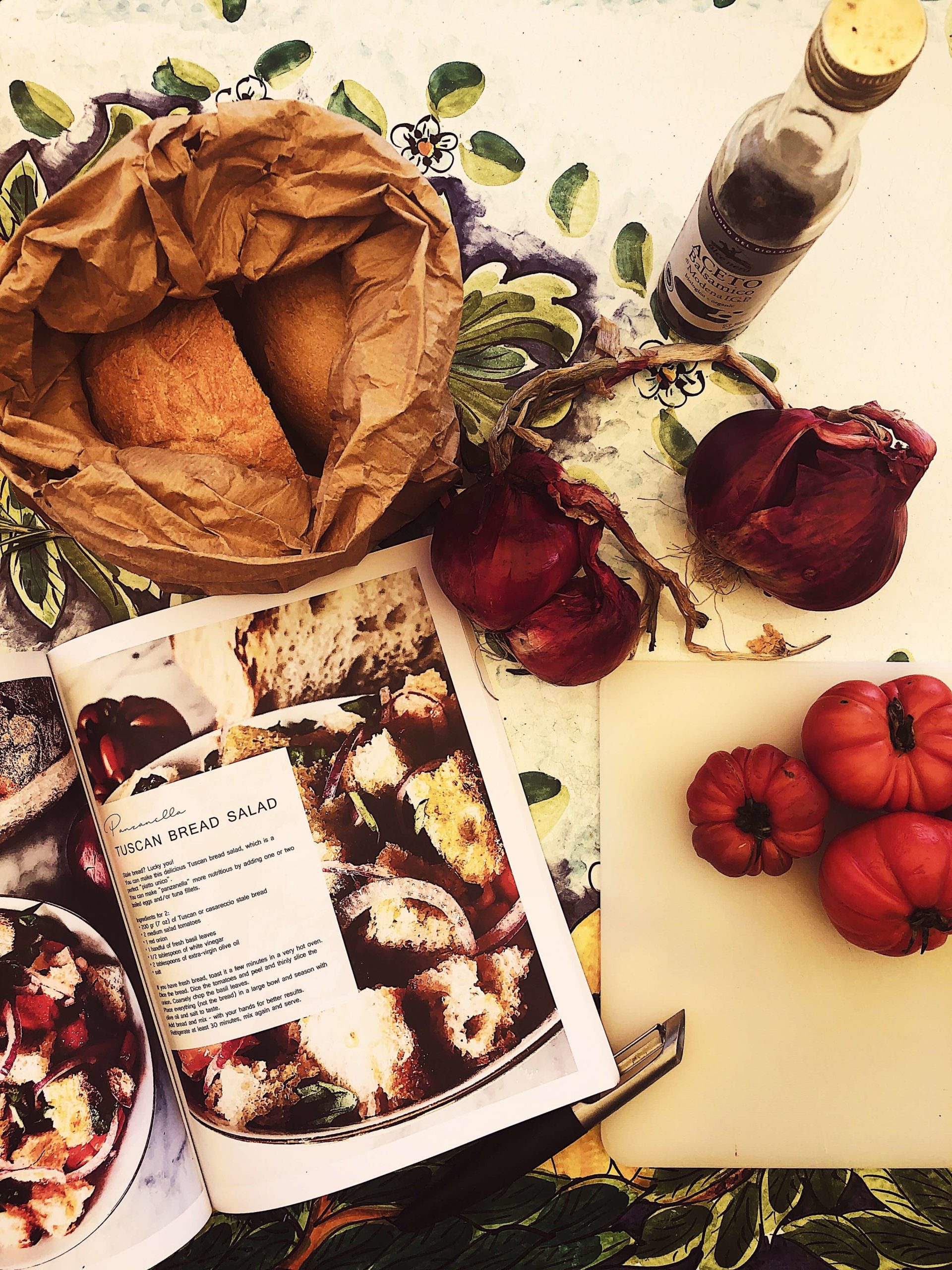 panzanella_simposio panzanella salad recipe on the Simposio magazine laying on a cooking table