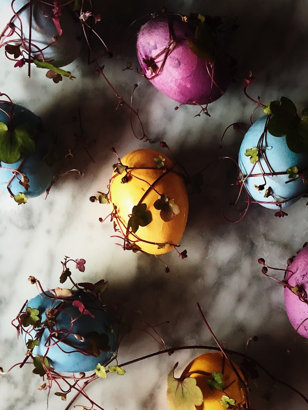 easter table setting with colored eggs
